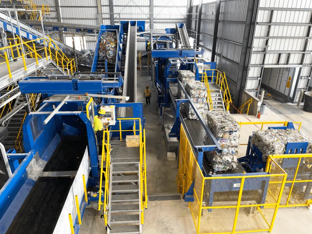 Two Dewiring machines dewiring plastic bales