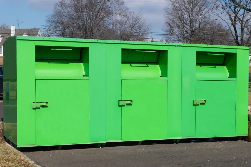 On Image: A green clothing deposit container